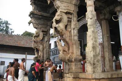 Carved yali pillars at the entrance to Sree Padmanabhaswamy Temple, Thiruvananthapuram, the richest temple in the world by treasure