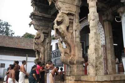 Carved pillars at the entrance to Padmanabhaswamy Temple